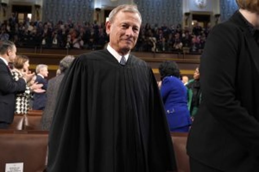 Chief Justice John Roberts decries threats to judges, defiance of rulings