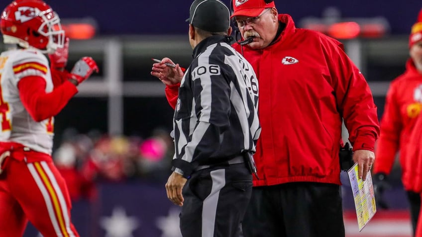 Andy Reid talks to a referee