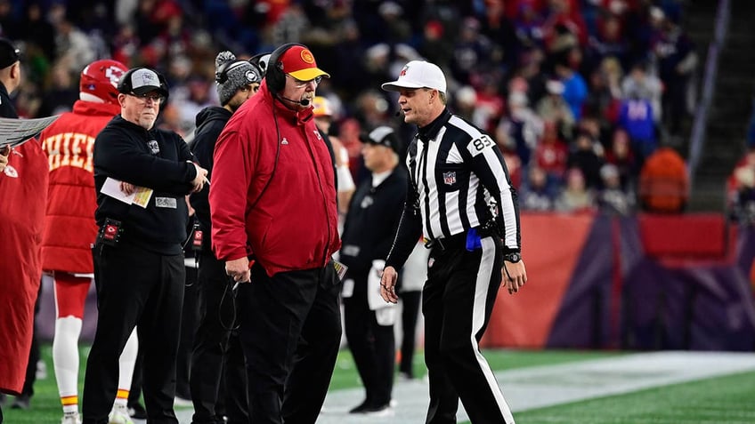 Andy Reid talks to an official 