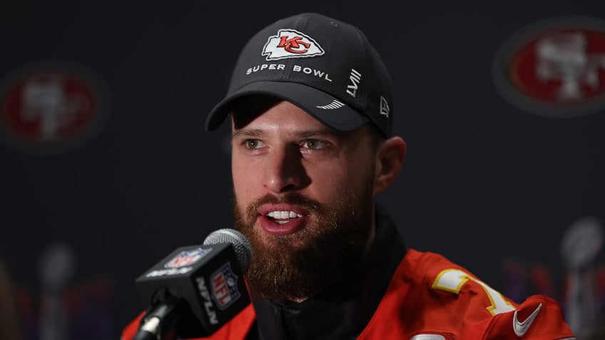 Harrison Butker talks to reporters