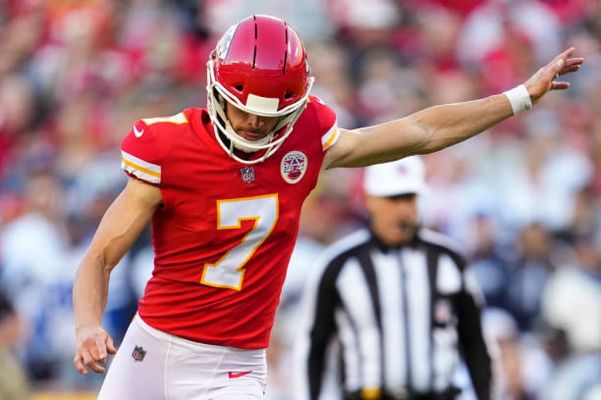 Harrison Butker of the Kansas City Chiefs kicks against the Dallas Cowboys during an NFL game at Arrowhead Stadium on November 21, 2021 in Kansas...