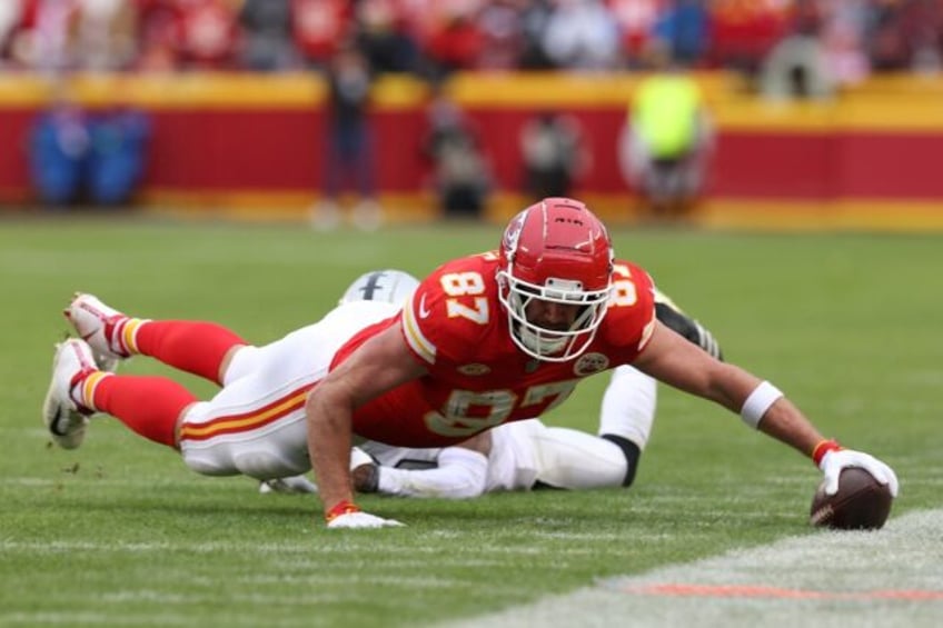 Kansas City Chiefs tight end Travis Kelce reaches for the sideline after catching a pass in the team's NFL loss to the Las Vegas Raiders