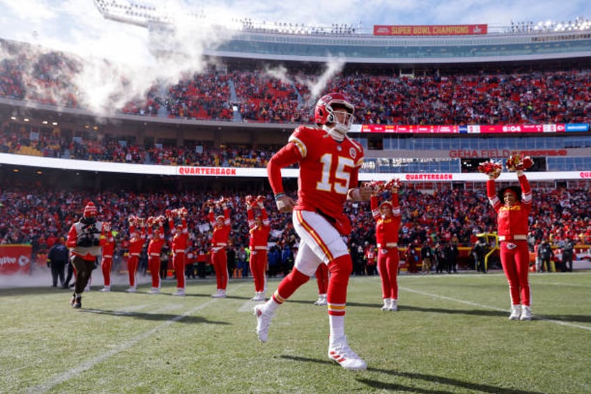 Patrick Mahomes of the Kansas City Chiefs runs onto the field during pregame against the Seattle Seahawks at Arrowhead Stadium on December 24, 2022...