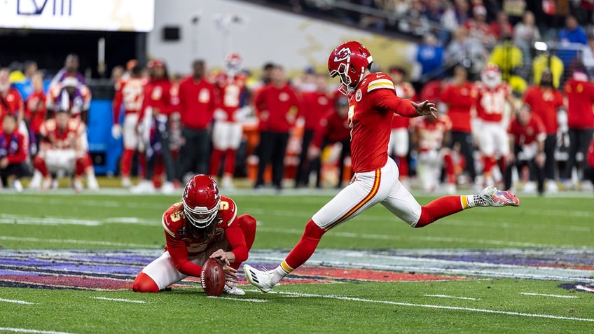 Harrison Butker kicks a field goal