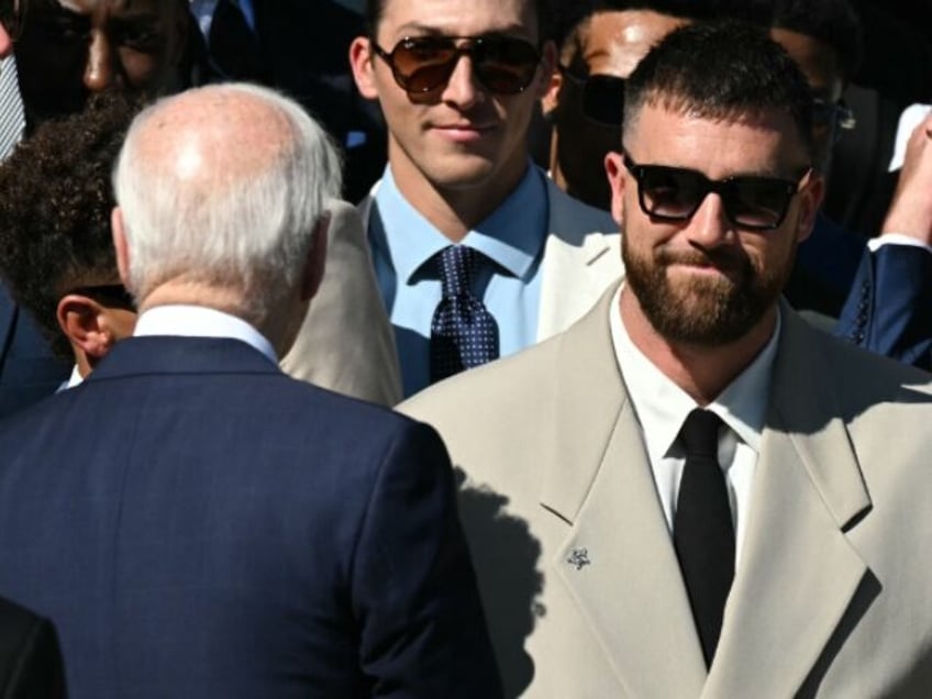 US President Joe Biden greets players including Kansas City Chiefs' tight end Travis