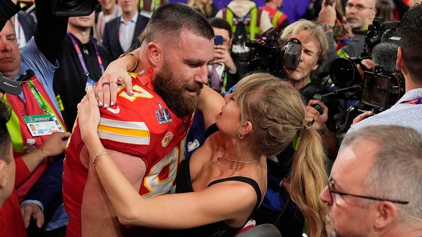 Travis Kelce embraces Taylor Swift after the NFL Super Bowl 58 football game