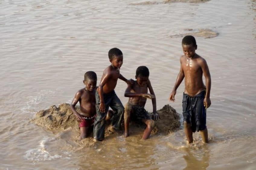 Children play in the waters of the Gash River some 600 kilometres from Sudanese capital Kh