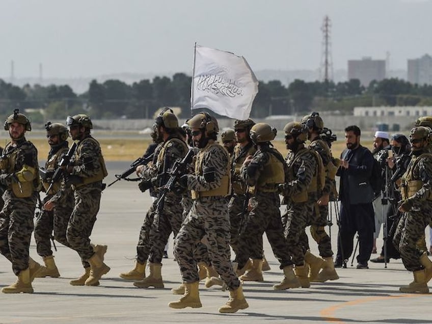 Members of the Taliban Badri 313 military unit arrive at the Kabul airport in Kabul on August 31, 2021, after the US has pulled all its troops out of the country to end a brutal 20-year war -- one that started and ended with the hardline Islamist in power. (Photo by WAKIL KOHSAR / AFP) (Photo by WAKIL KOHSAR/AFP via Getty Images)