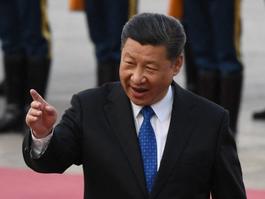 Uzbekistan President Shavkat Mirziyoyev (R) listens to Chinese President Xi Jinping (L) during a welcome ceremony outside the Great Hall of the People in Beijing on May 12, 2017. Mirziyoyev is on a state visit to China to attend the Belt and Road Forum for International Cooperation. (GREG BAKER/AFP via …