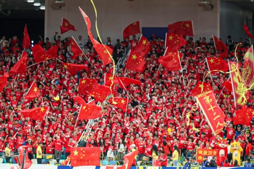 Chinese fans cheer their team on during a home World Cup qualifier