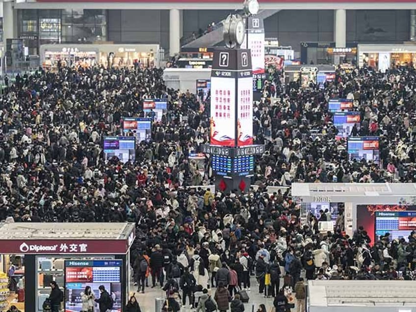 Travelers at the Hongqiao High-Speed Railway Station ahead of the Lunar New Year holiday in Shanghai, China, on Friday, Jan. 26, 2024. China is gearing up for a record number of trips during Lunar New Year and has vowed efforts to ensure safety as hundreds of millions of people take …