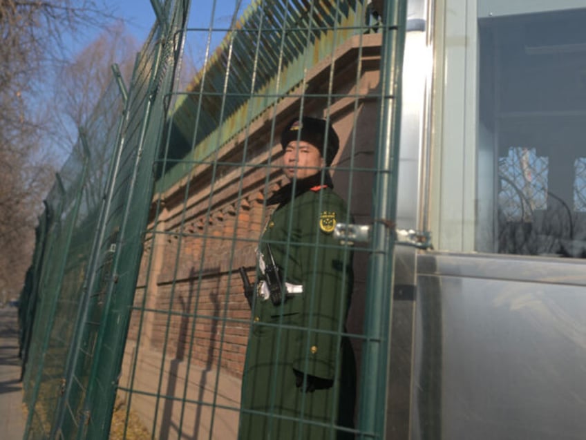 A Chinese paramilitary police stands guard outside the British embassy in Beijing on January 8, 2024. (Photo by Pedro PARDO / AFP) (Photo by PEDRO PARDO/AFP via Getty Images)