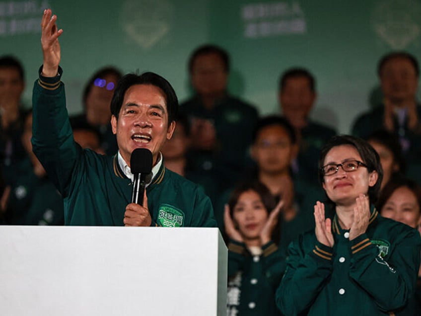 Taiwan's President-elect Lai Ching-te (L) gestures beside his running mate Hsiao Bi-khim during a rally outside the headquarters of the Democratic Progressive Party (DPP) in Taipei on January 13, 2024, after winning the presidential election. Taiwan's ruling party candidate Lai Ching-te, branded a threat to peace by China, on January …