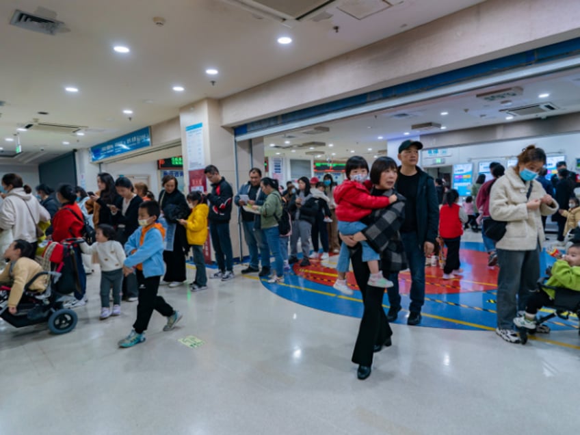 china hospitals set up homework stations as child pneumonia cases surge