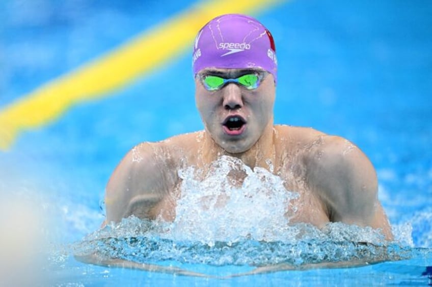 china in control as backstroke king qin sets new asian games mark