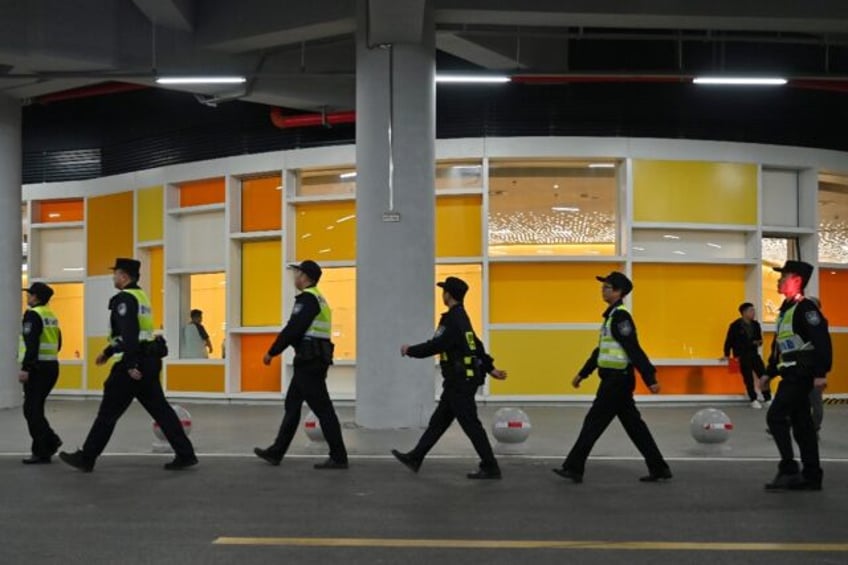 Police ahead of the World Cup qualification football match between China and Japan in Xiam