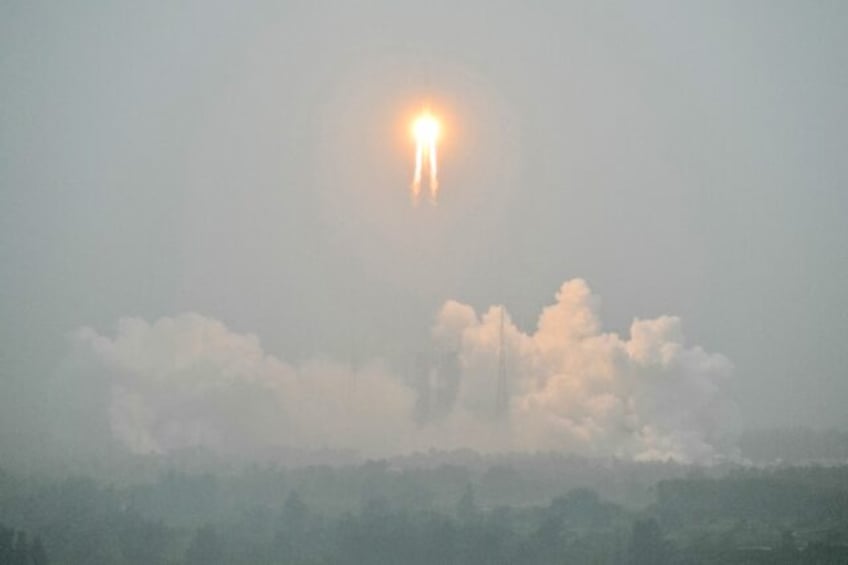 A Long March 5 rocket, carrying the Chang'e-6 mission lunar probe, lifted off from the Wen