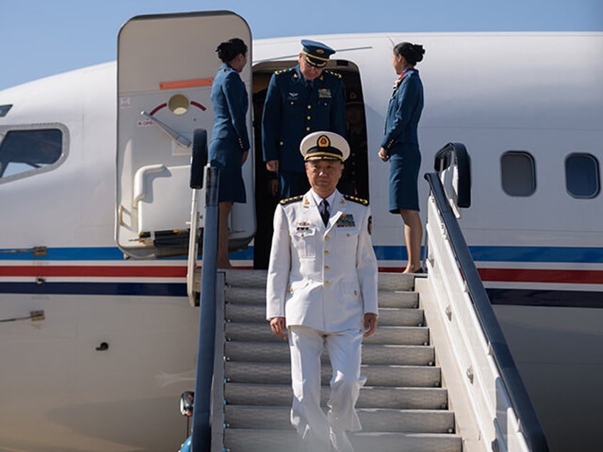 Miao Hua (C), China's director of the political affairs department of the Central Military