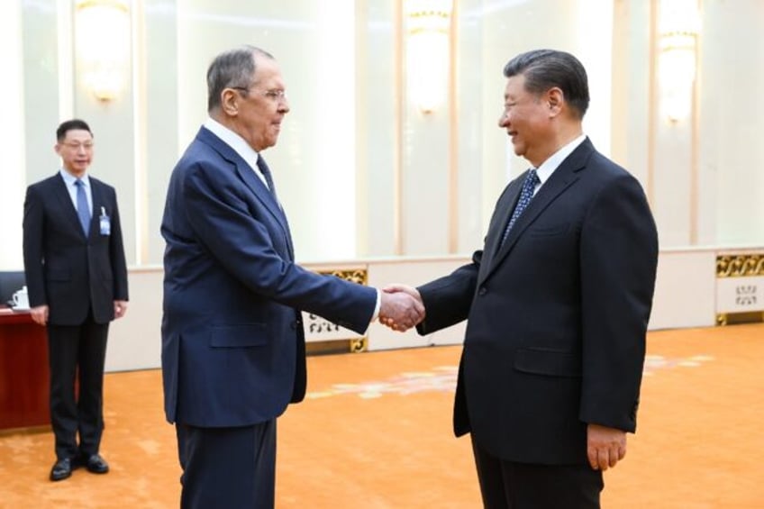 China and Russia said they would strengthen strategic cooperation as Foreign Minister Serg