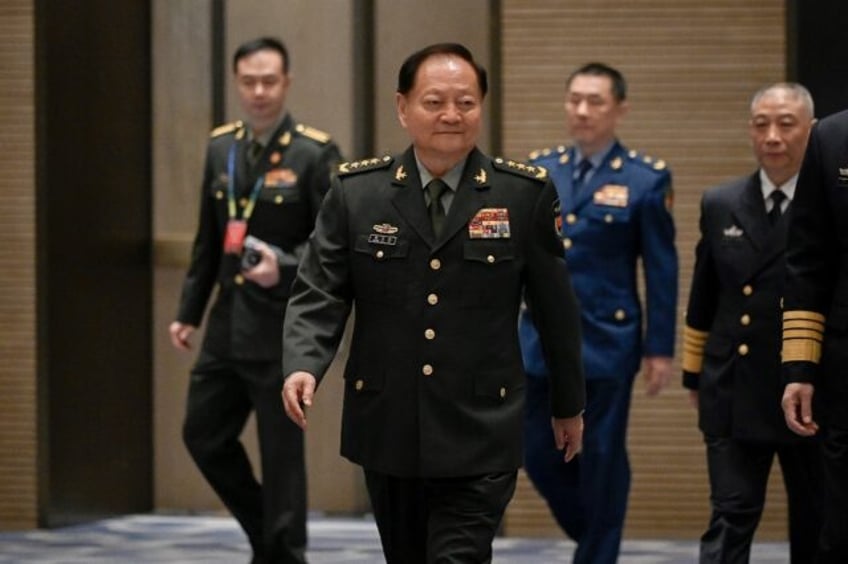 Senior Chinese defence official Zhang Youxia (C) called for 'friendly consultations' on ma