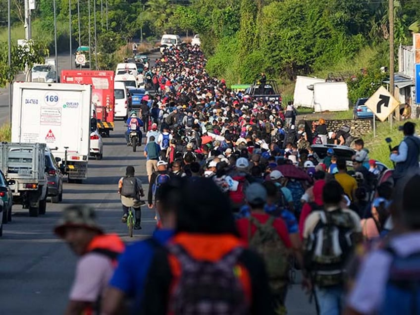 Sanctuary - Migrants walk along the Huixtla highway after departing Tapachula, southern Mexico, hoping to reach the country's northern border and ultimately the United States, Tuesday, Nov. 5, 2024. (AP Photo/Moises Castillo)