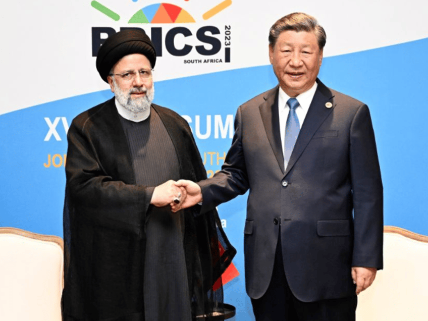 Chinese President Xi Jinping meets with Iranian President Ebrahim Raisi on the sidelines o