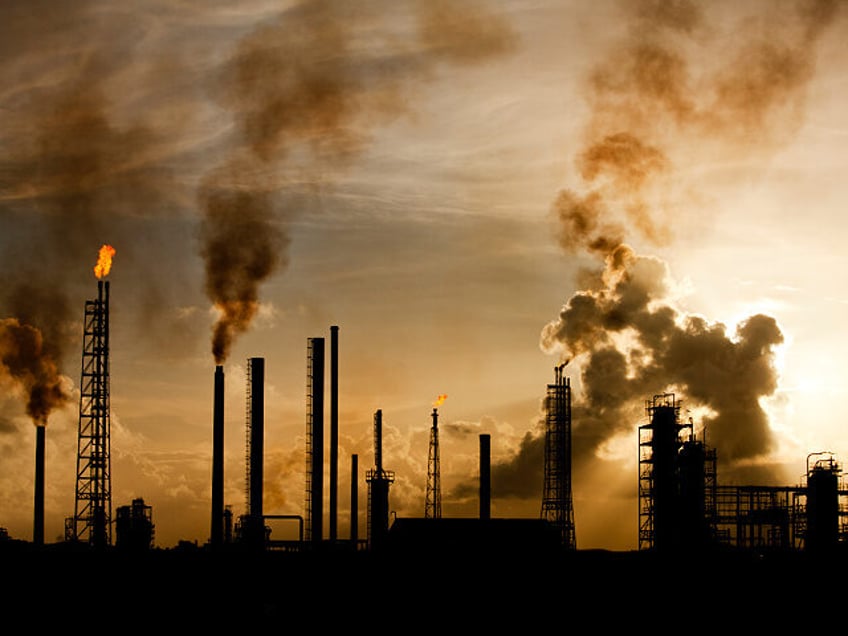 Oil Refinery at Curacao - stock photo Netherlands Antilles, Curacao, Flames and smoke billow from natural gas flares and smokestacks at Venezuela-owned Isla Oil Refinery.