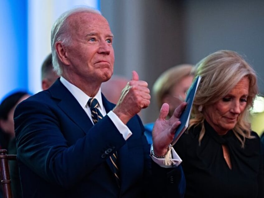 President Joe Biden gives a thumbs up as NATO Secretary General Jens Stoltenberg delivers