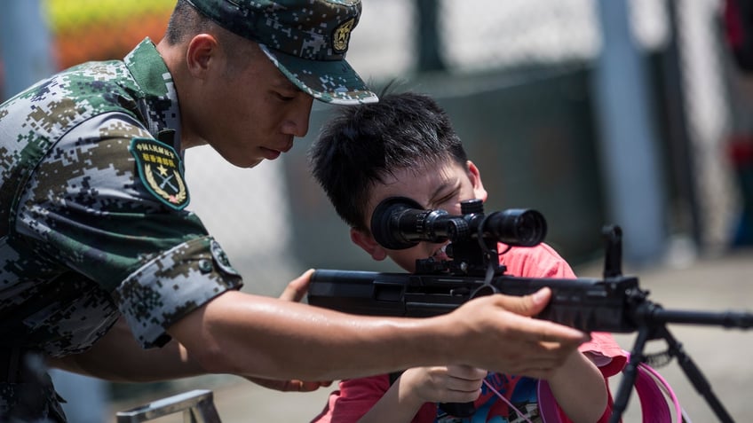 china trains children for iron army in latest effort to create national combat readiness report