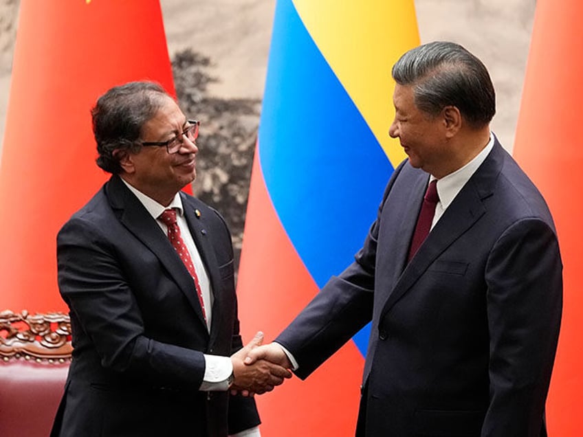 Chinese President Xi Jinping, right, shakes hands with Colombian President Gustavo Petro d