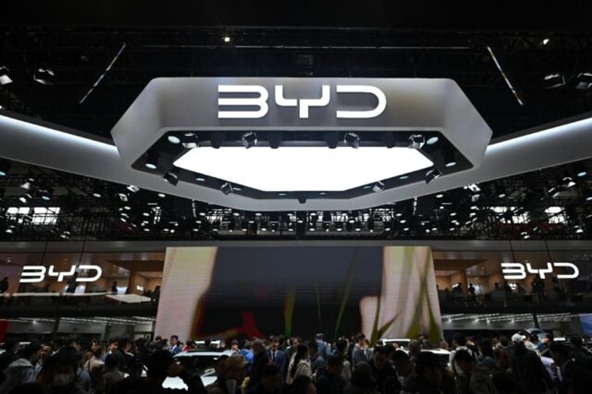 People visit the BYD stand at the Beijing Auto Show on April 29, 2024