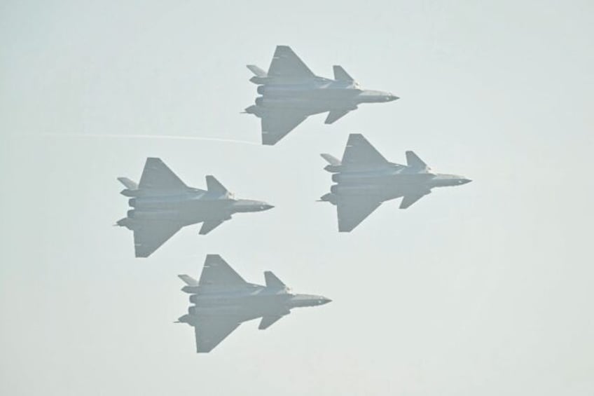 Chinese-made Chengdu J-20 stealth fighters fly in formation at Airshow China