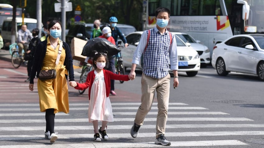 Parents and children holding hands