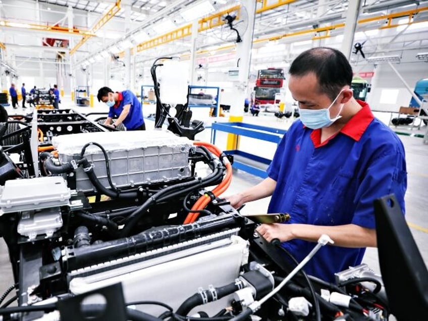 HUAI'AN, CHINA - JULY 06: Employees work on production line at a new factory of China