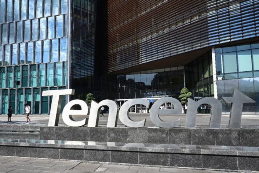People walking past the Tencent headquarters in Shenzhen in China's southern Guangdong pro
