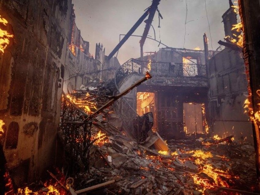 The Palisades Fire burns a residence in the Pacific Palisades neighborhood of Los Angeles,