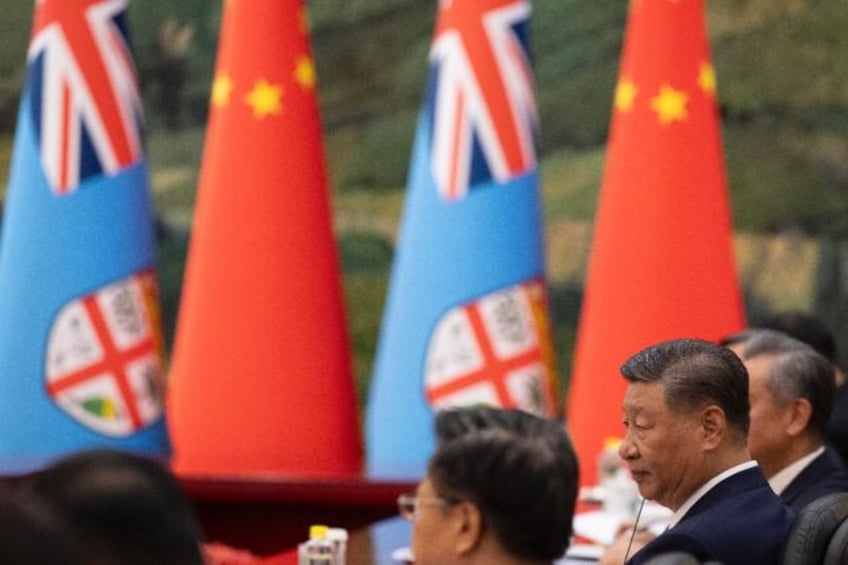 Chinese President Xi Jinping pledged to strengthen ties with Fiji in a world beset with "t