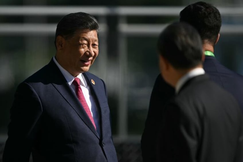 Chinese President Xi Jinping urged leaders to help 'cool the Ukraine crisis and seek a pol