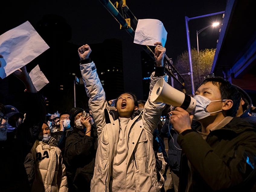 chinese activists commemorate one year anniversary of white paper protests