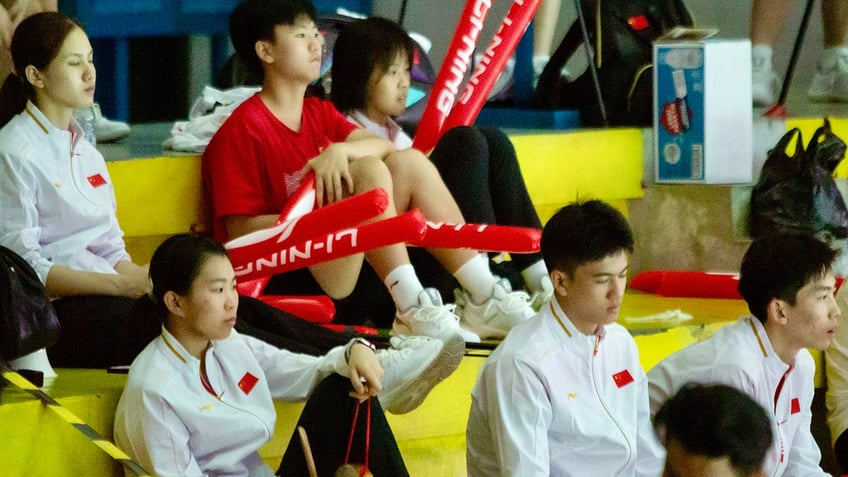 Badminton players in stands