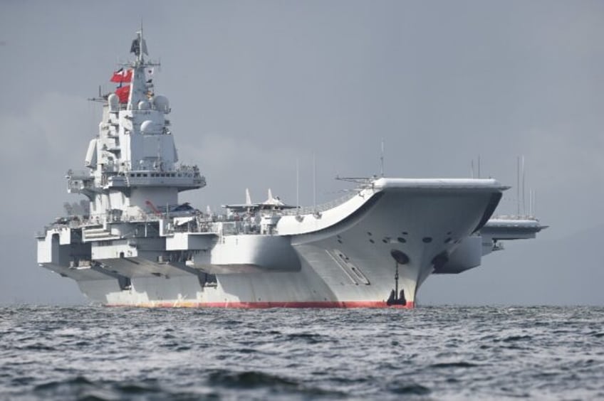 The Liaoning seen in Hong Kong waters in 2017. The aircraft carrier sailed through waters