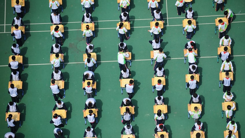 Students playing chinese chess