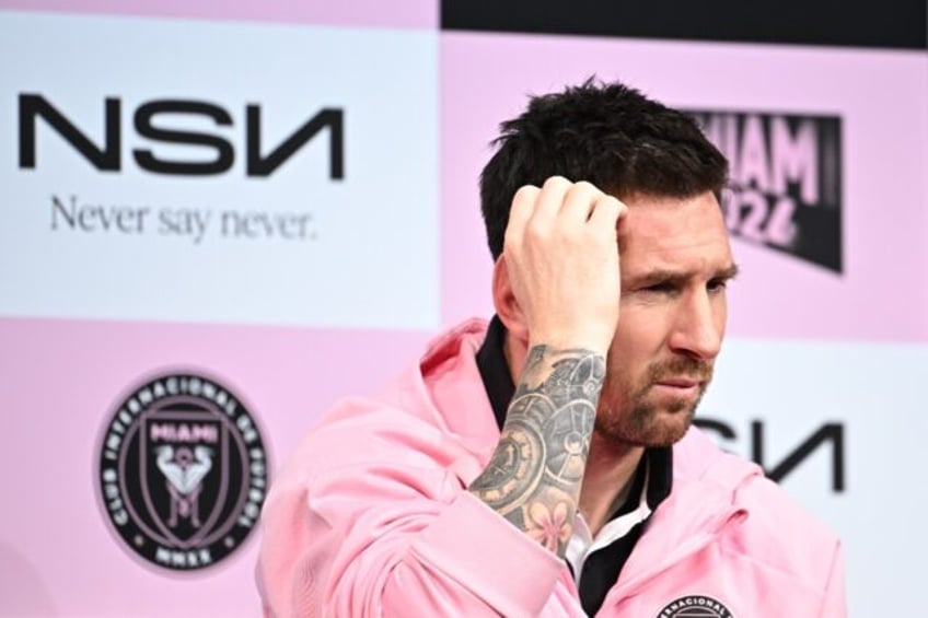 Lionel Messi talks to reporters in Tokyo two days after being booed off for sitting out a