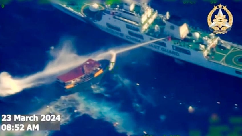 Chinese boat blasting water