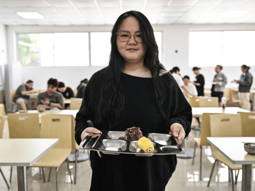This photo taken on October 23, 2024 shows Yang Chi'ao having lunch at a weight loss camp