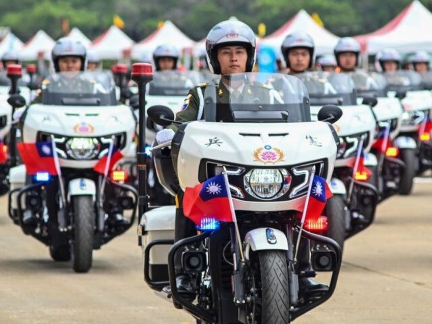 A Taiwanese military police unit demonstrate their motorcycle skills during a military ope