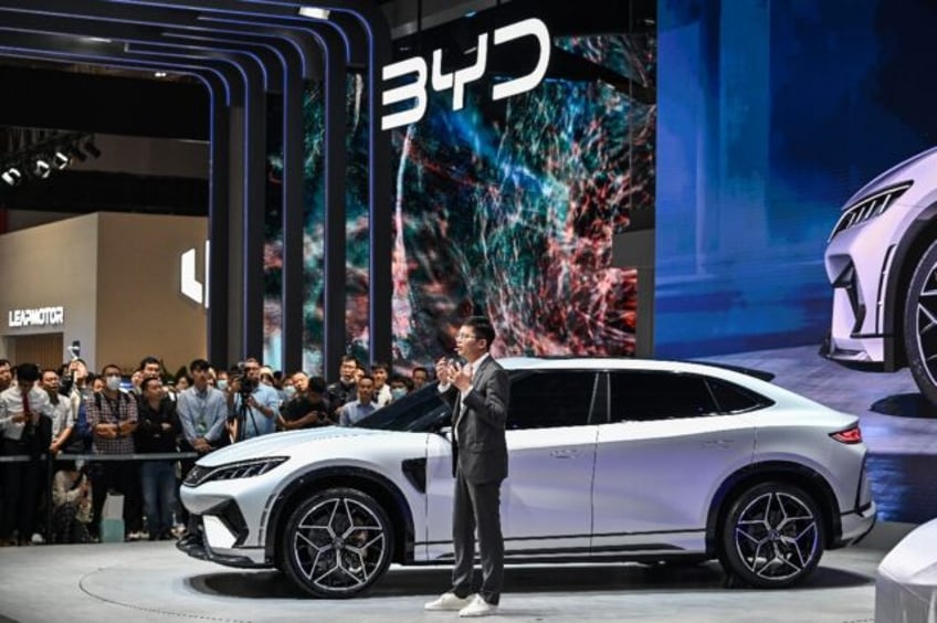 chinese electric carmaker byd triples half year profit