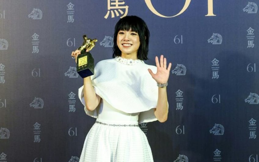 Hong Kong actress Chung Suet-ying poses after winning the best leading actress title at th