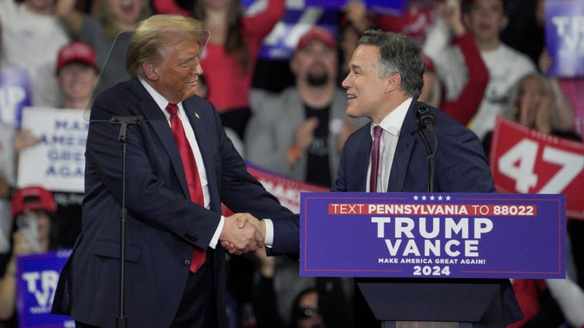 former President Trump shaking Dave McCormick's hand at rally