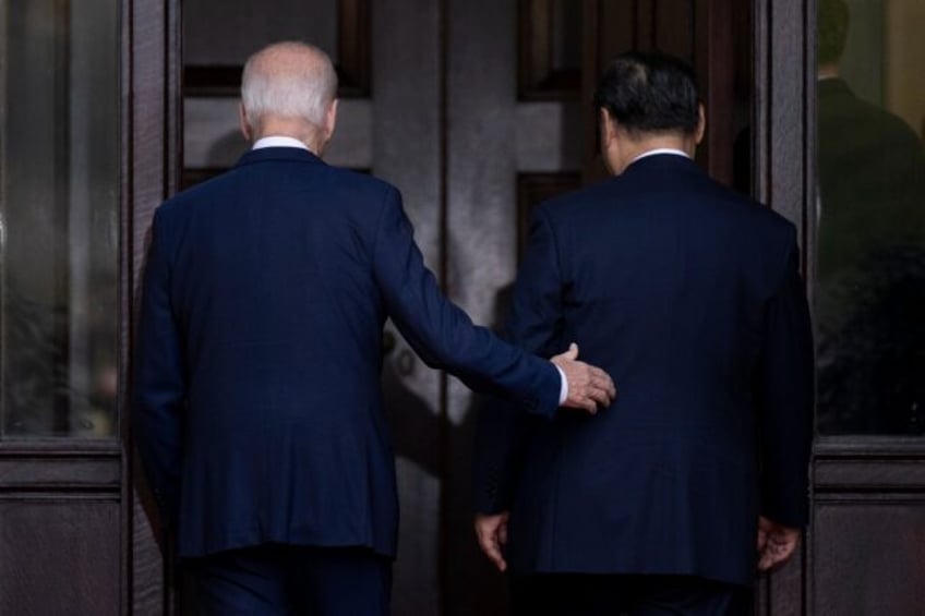 US President Joe Biden and Chinese President Xi Jinping arrive for a summit in Woodside, California on November 15, 2023